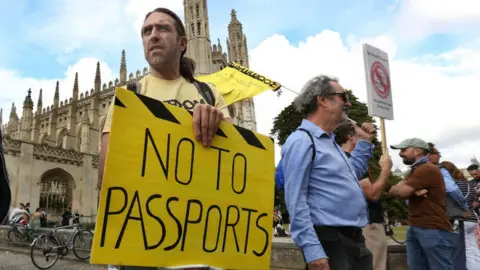 Getty Images protestors hold banners