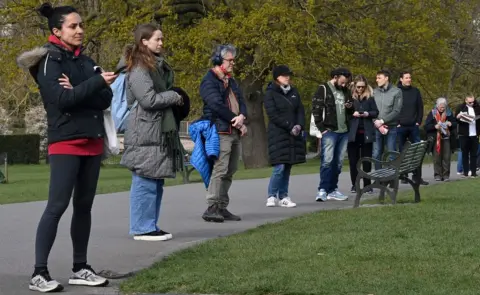 Getty Images People queuing for tests in Brockwell Park