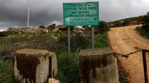 AFP Israeli military warning sign on the Israel-Lebanon border, near the Israeli village of Arab al-Aramshe (15 March 2023)