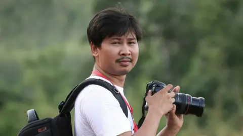 Reuters Reuters journalist Wa Lone, who was arrested in Myanmar, is seen in this 1 June 2015 photo.