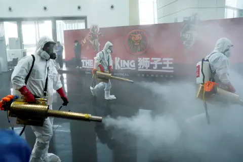 Reuters Volunteers disinfect the Qintai Grand Theatre in Wuhan