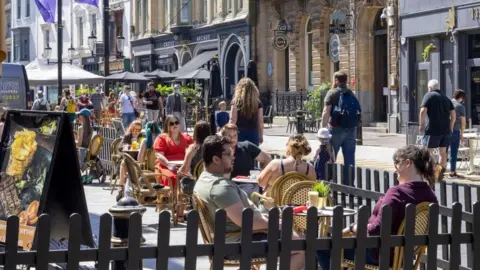 BBC People sat in a street