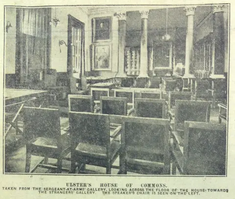 Belfast Telegraph Black and white photo looking across the floor of the House of Commons in the Gamble Library