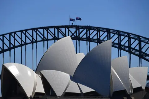 EPA he Australian flag is seen half mast on the Sydney Harbour Bridge following the death of Prince Philip, Duke of Edinburgh, at Admiralty House, in Sydney, Australia, 10 April 2021.