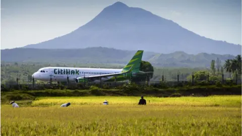 Getty Images A plane taking off from an airport in Indonesia