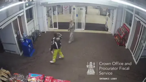 COPFS A couple in the entrance to a supermarket