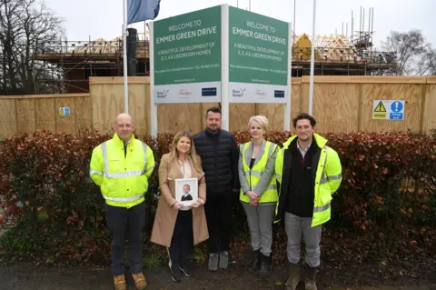 Vistry Group George's parents with members of Vistry Group on the spot where Fox Crescent will be