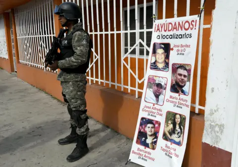 Getty Images A banner showing the five youths who went missing in Tierra Blanca in January 2016