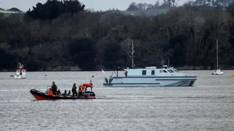 MOD Crown copyright/PA Royal Navy Bomb Disposal Team leaving the slip to Torpoint Ferry as they dispose of the WWII bomb