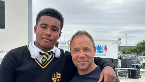 Lewis Pemberton and Stephen Graham on the set of Netflix drama adolescence with filming equipment in the background