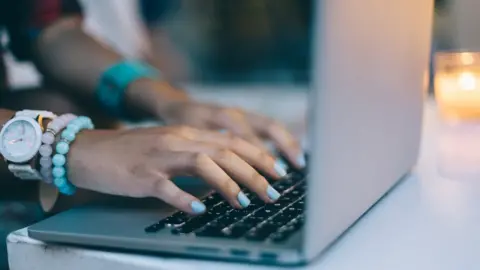 Getty Images hands on keyboard