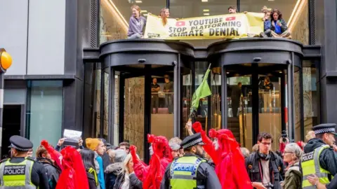 Getty Images Extinction Rebellion on top of YouTube building