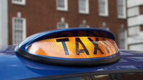 Getty Images Taxi sign