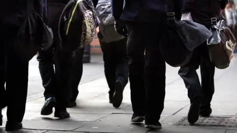 PA Media Children in a school