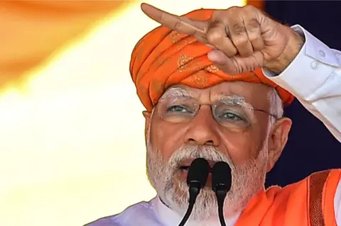 Getty Images Modi at an election rally in Gujarat