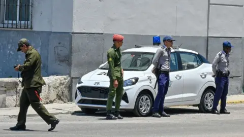 Getty Images Police guard a street on the second anniversary of anti-government protests in Havana, on July 11, 2023