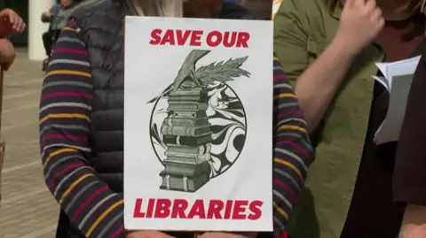 A 'save our libraries' sign