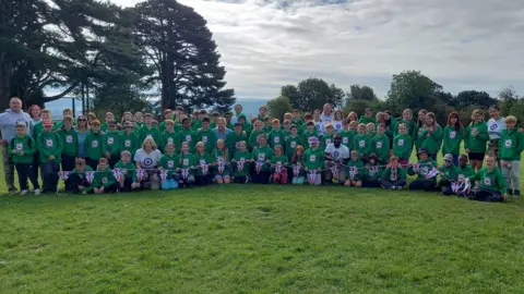 RAF Benevolent Fund Group picture of kids and volunteers at the camp