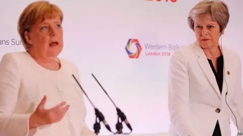 AFP Angela Merkel and Theresa May