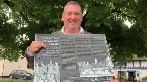 BBC Councillor Chris Lomax with Battle of Britain plaque