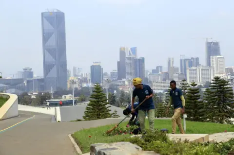 Getty Images Workers clean the Friendship Park in Addis Ababa, Ethiopia on July 05, 2022. There are jogging - walking paths, bicycle paths, conference and gymnasiums and a restaurant in the Friendship located in the Arat Kilo district of Addis Ababa. The park awaits its local and foreign visitors.
