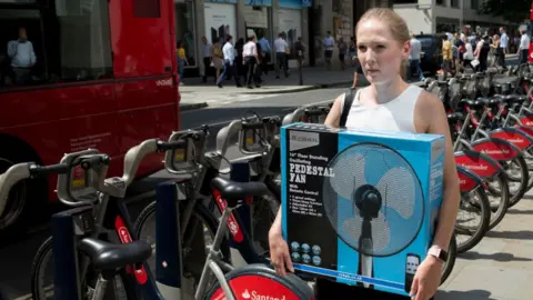 Getty Images lady carrying fan