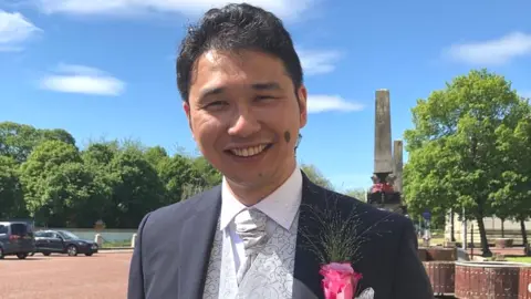 Family photo Kar Hao Teoh, of Bishop's Stortford, photographed on his wedding day