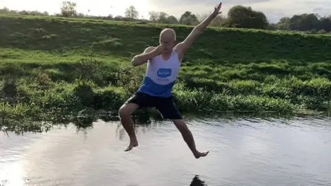 Sue Ryder Stuart Golledge jumping into water