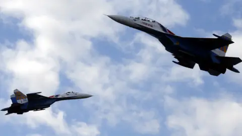 EPA Two Russian SU-27s performing during the International Maritime Defence Show in Russia in 2015
