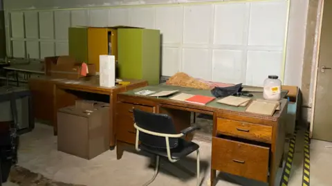 An image of a government desk inside Nottingham War Rooms