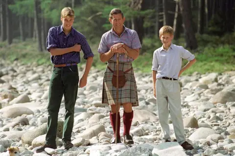 Getty Images Prince Charles Holding A Walking Stick Styled As A Shepherd's Crook Stick With Prince William And Prince Harry At Polvier, By The River Dee, Balmoral Castle Estate (Photo by Tim Graham Photo Library via Getty Images) -1997