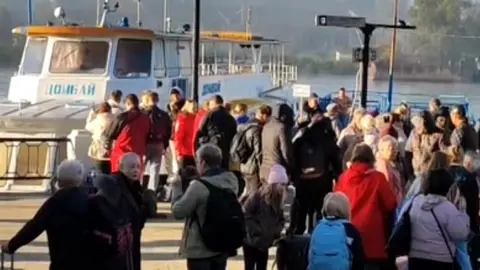 Rossiya 24 Russian TV channels showed footage of people gathering to cross the Dnieper river