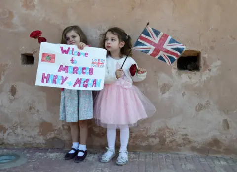 EPA Two girls welcome Prince Harry and Meghan to Morocco