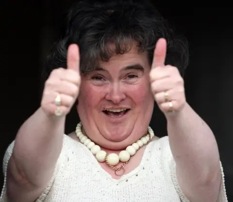 PA Media Susan Boyle giving the thumbs up at her Blackburn home