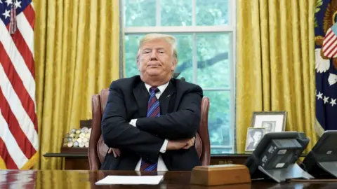 AFP In this file photo taken on August 27, 2018 US President Donald Trump speaks to reporters after a phone conversation with Mexico"s President Enrique Pena Nieto on trade in the Oval Office of the White House in Washington, DC.