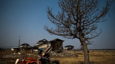 Getty Images A picture of a house in Odaka in 2013 after it was devastated by the 2011 Fukushima nuclear disaster