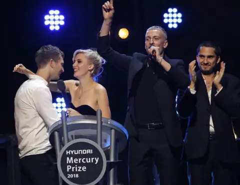 AFP/Getty Joff Oddie, Ellie Rowsell, Theo Ellis and Joel Amey of Wolf Alice celebrate their award