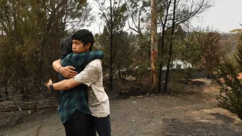 The Sydney Morning Herald Gabriel Kam hugs his mother