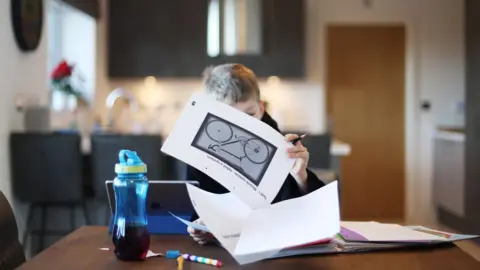 Reuters Boy doing homeschooling