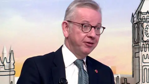 Michael Gove sat in a BBC studio