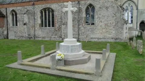 Adrian S Pye Kedington War Memorial in the Churchyard of St Peter and St Paul, Suffolk