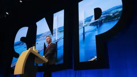 PA Media Derek Mackay