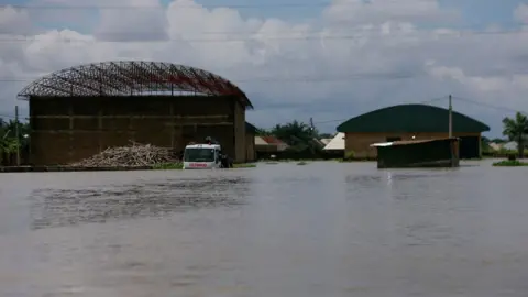 Submerged cars in a rural town