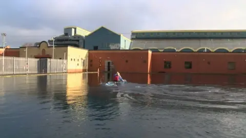 BBC Man kayaking in an outdoor pool