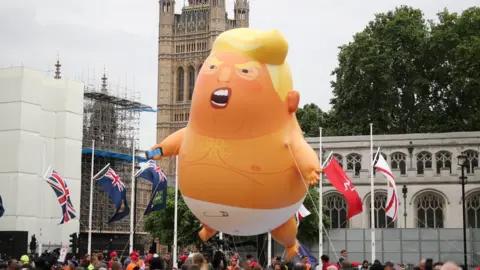 Reuters Trump balloon flying over Parliament Square