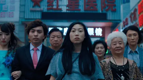Entertainment Films Awkwafina (centre) played Bill in The Farewell