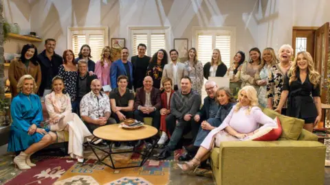 Getty Images The Neighbours cast during the final day on set