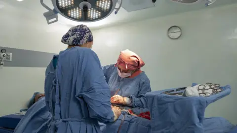 Getty Images A caesarean section being performed