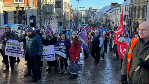 Cate McCurry/PA Media Rallies were held across NI on Thursday, including this one in Omagh