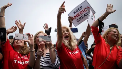 Reuters Supporters cheer for Mr Trump during his visit to North Carolina